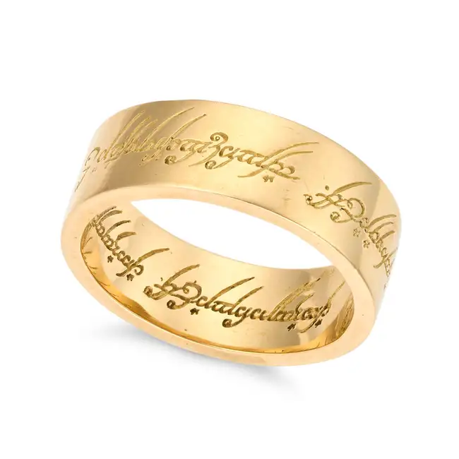 NO RESERVE - A LIMITED EDITION 'LORD OF THE RINGS' ONE RING in 18ct yellow gold, the band engraved