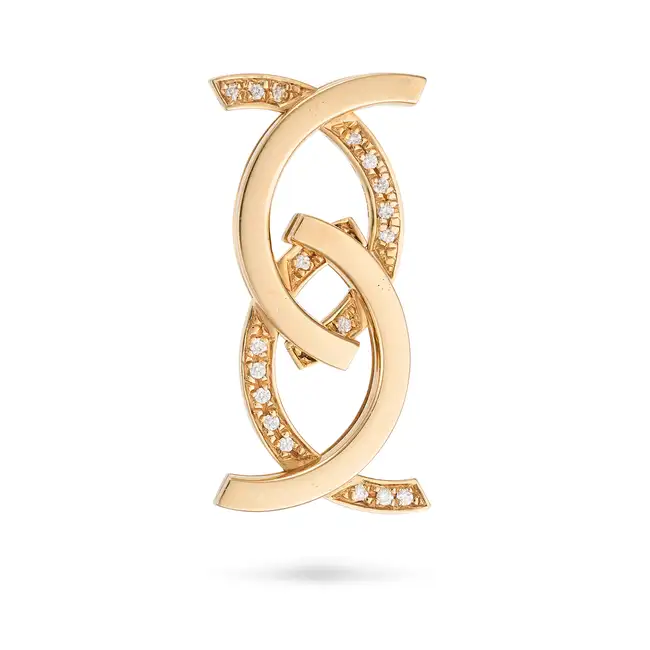 AN ARTICULATED DIAMOND RING / PENDANT in 18ct rose gold, designed as a band ring, convertible to a