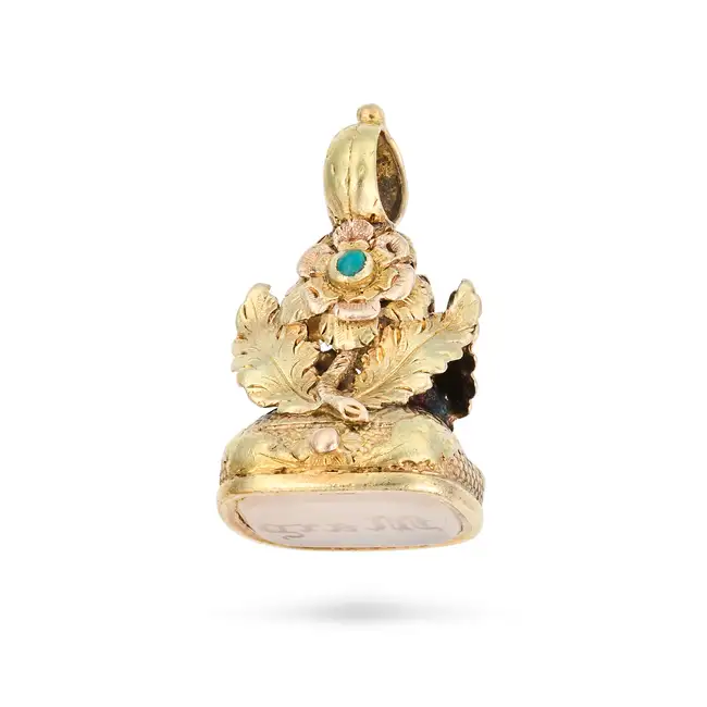 AN ANTIQUE TURQUOISE AND CHALCEDONY FOB SEAL / PENDANT designed as a flower set with round