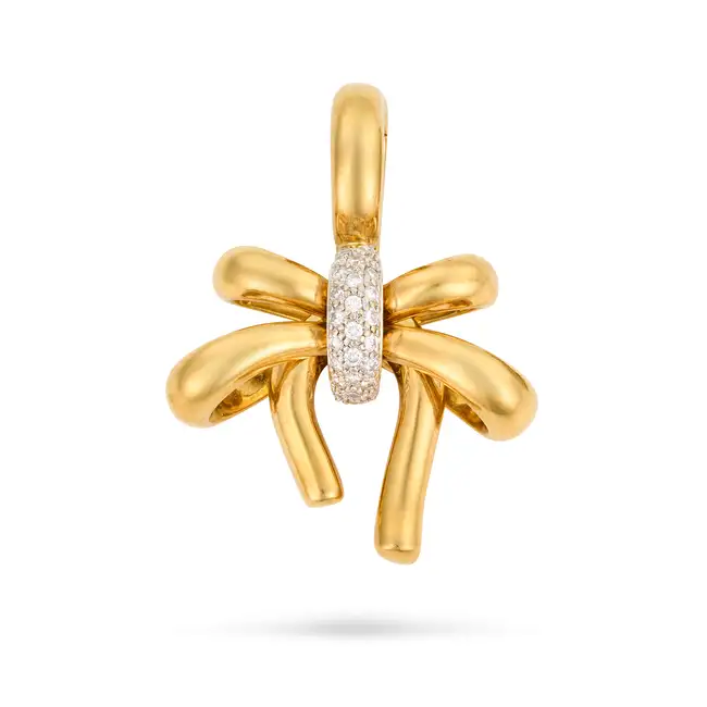 A DIAMOND BOW PENDANT designed as a bow, accented by pave set round brilliant cut diamonds,