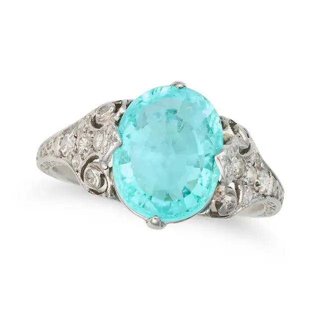 A FINE PARAIBA TOURMALINE AND DIAMOND DRESS RING set with an oval cut paraiba tourmaline of 3.51