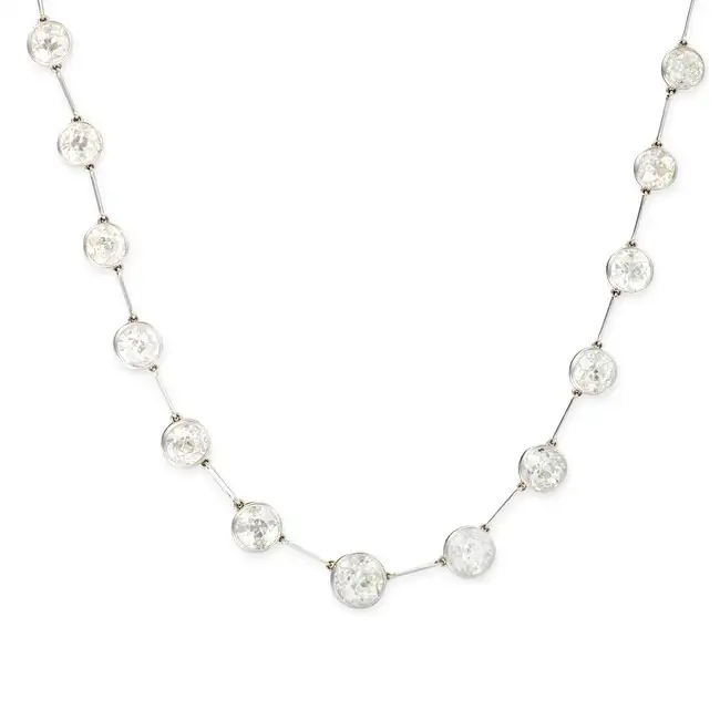 CHAUMET, A FINE ANTIQUE DIAMOND RIVIERE NECKLACE, EARLY 20TH CENTURY in platinum, comprising a row