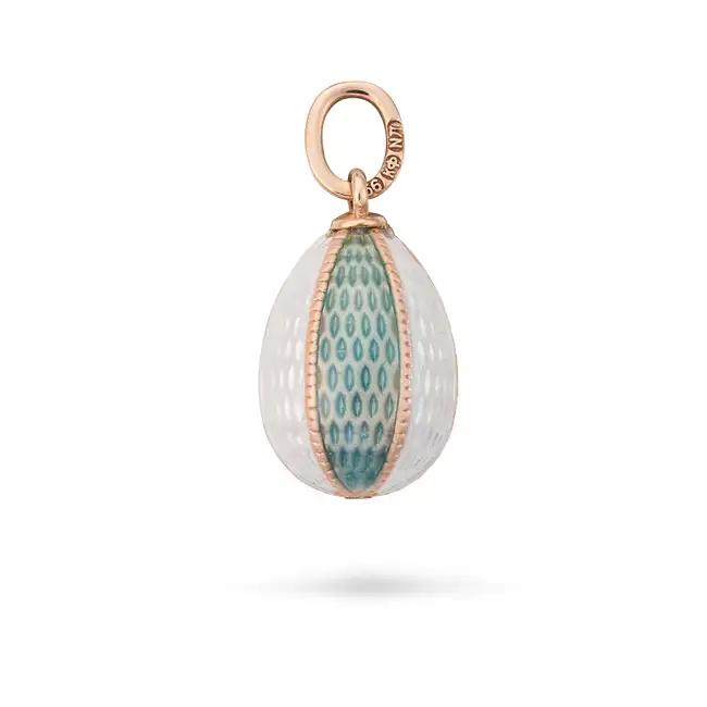 A RUSSIAN ENAMEL EGG PENDANT the egg shaped pendant relieved in teal and white enamel, the bail with
