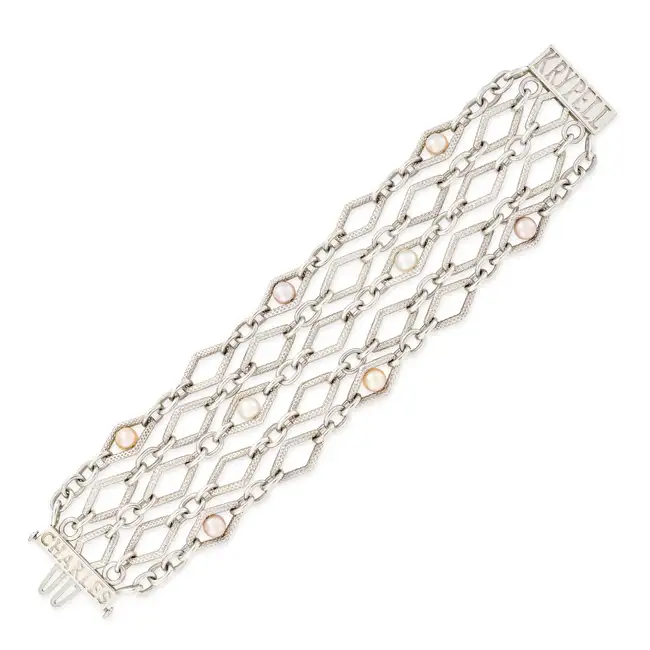 CHARLES KRYPELL, A SILVER PEARL BRACELET comprising five rows of textured links accented with