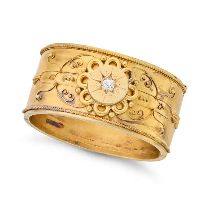 AN ANTIQUE VICTORIAN DIAMOND ETRUSCAN REVIVAL BANGLE in yellow gold, wide hinged bangle set with