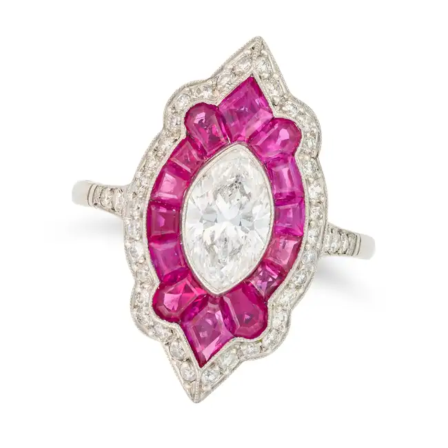 A FINE RUBY AND DIAMOND DRESS RING set with a marquise cut diamond of approximately 0.96 carats,