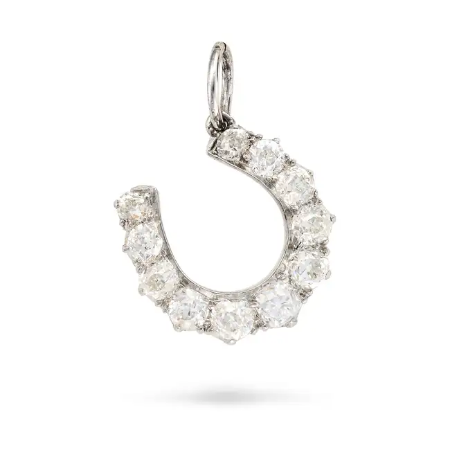 AN ANTIQUE DIAMOND HORSESHOE CHARM / PENDANT designed as a horseshoe set with old cut diamonds, no