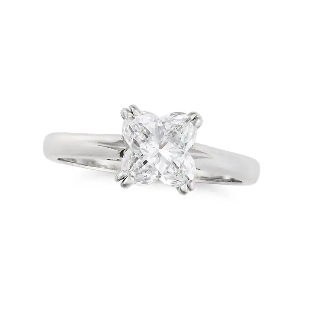 A FANCY CUT SOLITAIRE DIAMOND RING in platinum, set with a lily cut diamond of 1.64 carats, full