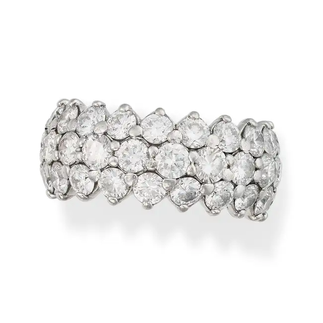 A FINE DIAMOND FULL ETERNITY RING set all around with three rows of round brilliant cut diamonds