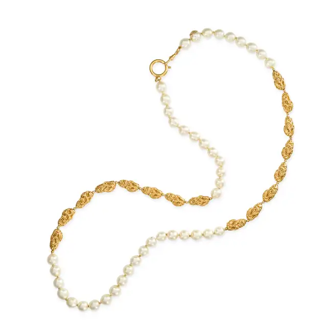 CHANEL, A FAUX PEARL AND GOLD METAL NUGGET NECKLACE comprising a strand of faux pearl and gold