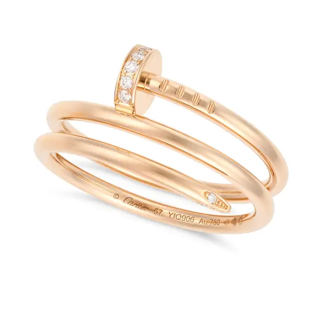 CARTIER, A DIAMOND JUSTE UN CLOU DOUBLE RING in 18ct rose gold, designed as a bent nail, accented by