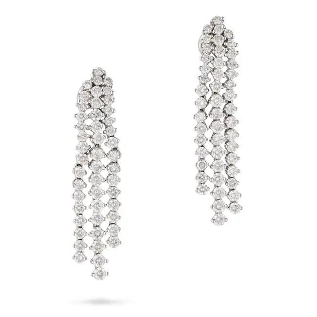 A PAIR OF DIAMOND DROP EARRINGS each suspending three rows of round brilliant cut diamonds, the