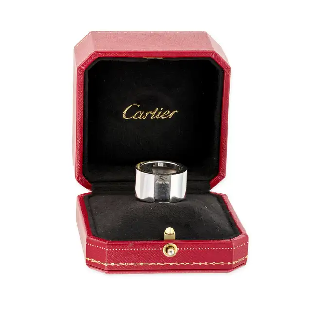 CARTIER, A RUTILATED QUARTZ TANK RING, 1999 in 18ct white gold, the wide band set with polished