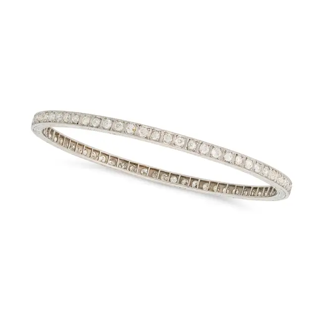 THREE ART DECO ONYX AND DIAMOND BANGLES, EARLY 20TH CENTURY one set all around with a row of old