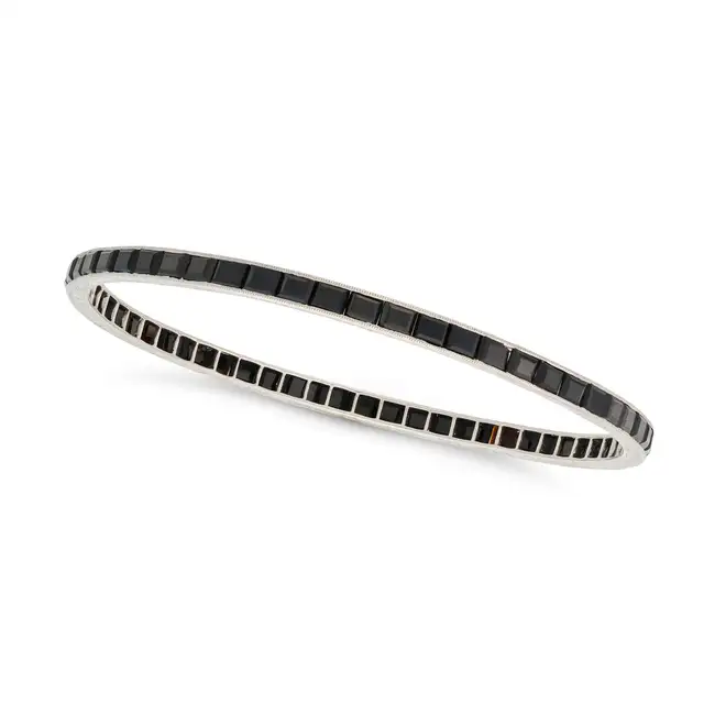 THREE ART DECO ONYX AND DIAMOND BANGLES, EARLY 20TH CENTURY one set all around with a row of old