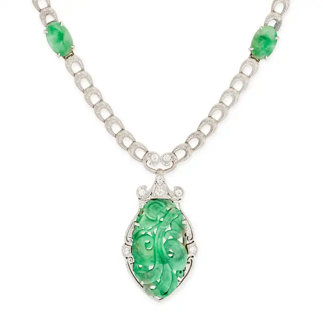 ALLSOPP & ALLSOPP, AN UNTREATED JADEITE JADE AND DIAMOND NECKLACE comprising a fancy engraved