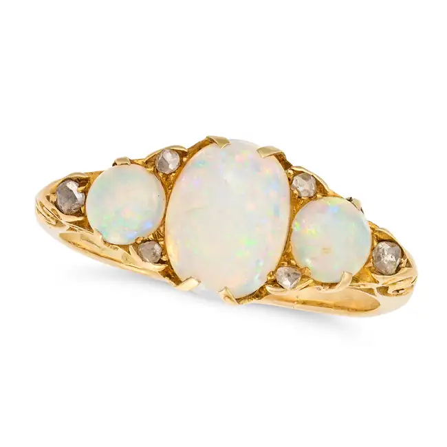 AN ANTIQUE OPAL AND DIAMOND RING in yellow gold, set with three cabochon opals accented by rose