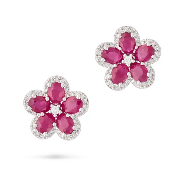 NO RESERVE - A PAIR OF RUBY AND DIAMOND STUD EARRINGS in 18ct white gold, each designed as a flower,