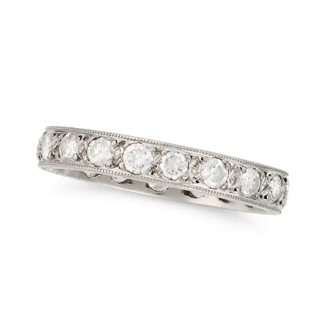 A VINTAGE DIAMOND FULL ETERNITY RING set all around with a row of round brilliant cut diamonds,