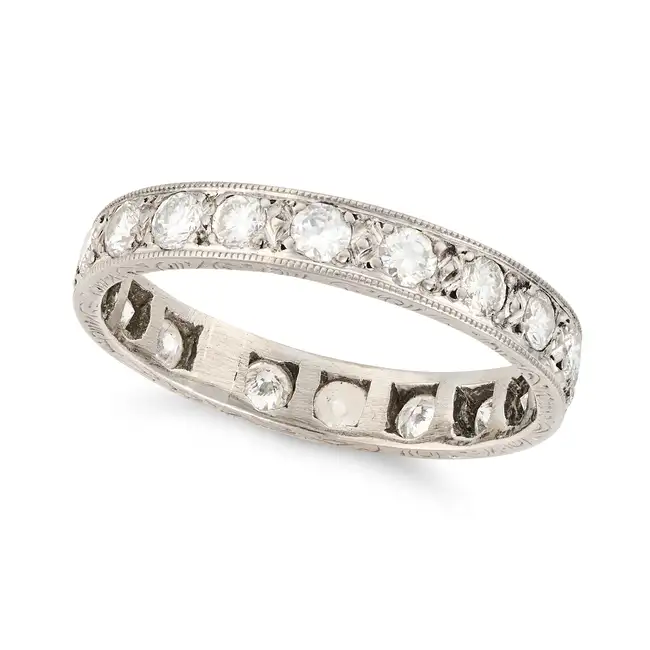 A VINTAGE DIAMOND FULL ETERNITY RING set all around with a row of round brilliant cut diamonds,