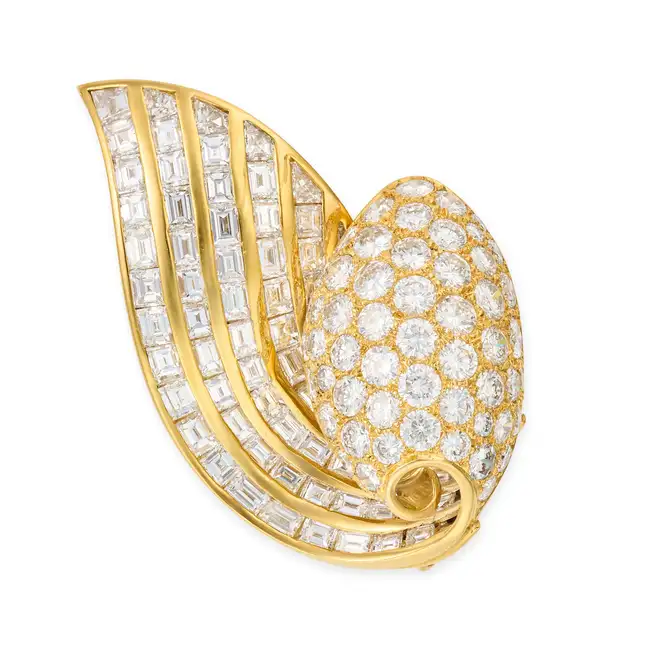 ADLER, A DIAMOND BROOCH designed as a scroll, pave set with round brilliant cut diamonds, accented