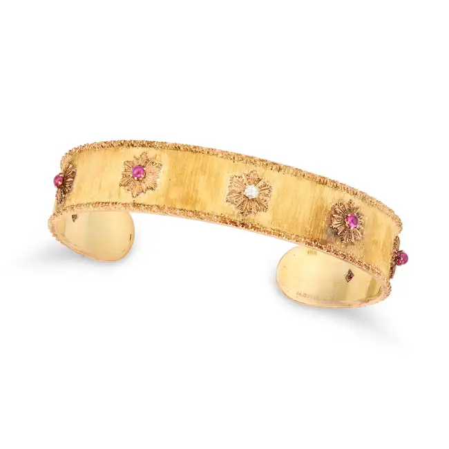 M. BUCCELLATI, A VINTAGE RUBY AND DIAMOND BANGLE, CIRCA 1950'S in 18ct yellow gold, the open cuff