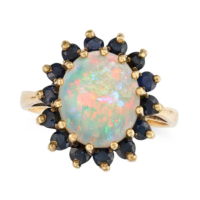 NO RESERVE - A VINTAGE OPAL AND SAPPHIRE CLUSTER RING, 1976 in 9ct yellow gold, set with an oval