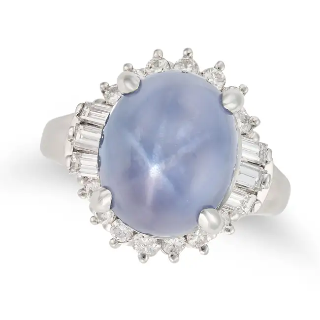 NO RESERVE - A 13.03 CARAT STAR SAPPHIRE AND DIAMOND RING set with a cabochon star sapphire of 13.03
