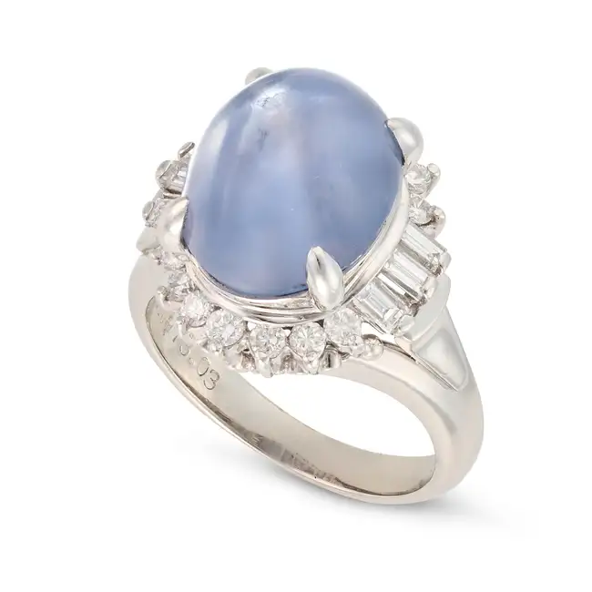 NO RESERVE - A 13.03 CARAT STAR SAPPHIRE AND DIAMOND RING set with a cabochon star sapphire of 13.03