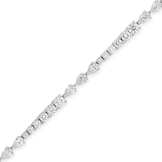 A FINE DIAMOND BRACELET set with graduating round brilliant cut diamonds and trios of pear brilliant