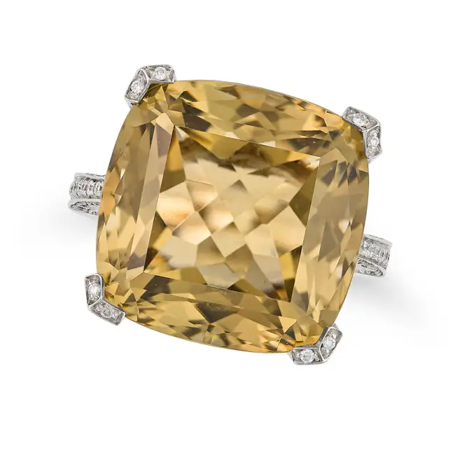 ASPREY, A CITRINE AND DIAMOND DRESS RING set with a cushion cut citrine of approximately 25.00