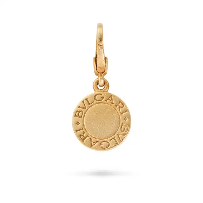 NO RESERVE - BULGARI, A BVLGARI BVLGARI CHARM / PENDANT in 18ct yellow gold and white gold, the