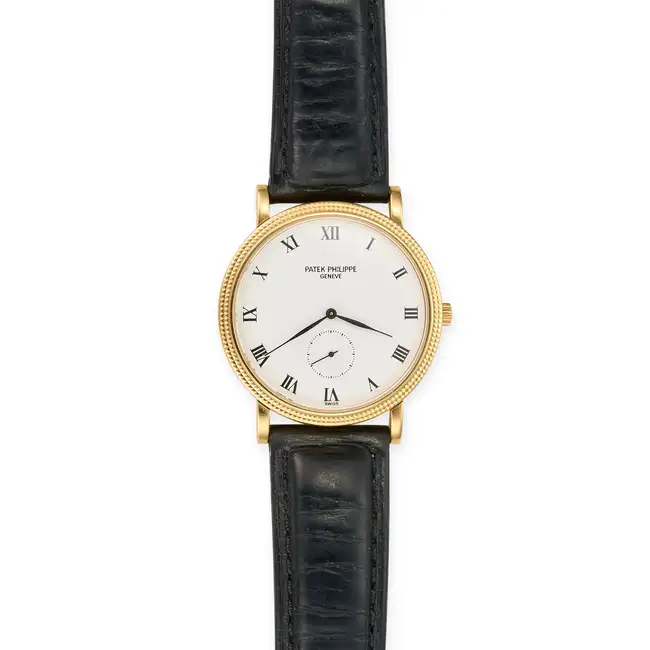 PATEK PHILIPPE, A GOLD CALATRAVA WRISTWATCH, ref. 3919J-001, in 18 carat yellow gold, the round case