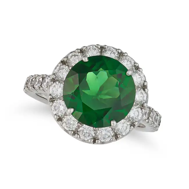 A FINE CHROME TOURMALINE AND DIAMOND CLUSTER RING set with a round cut chrome tourmaline of