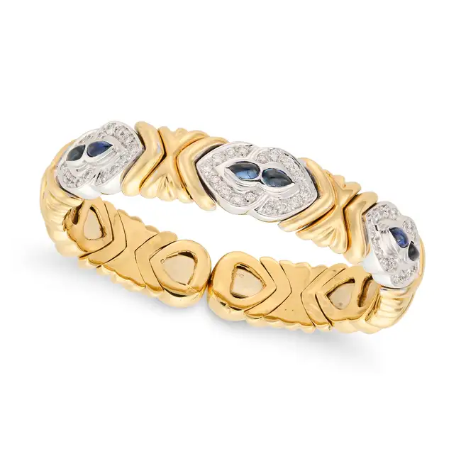 A FINE SAPPHIRE AND DIAMOND CUFF BANGLE the open cuff bangle in modular design, set with pear shaped
