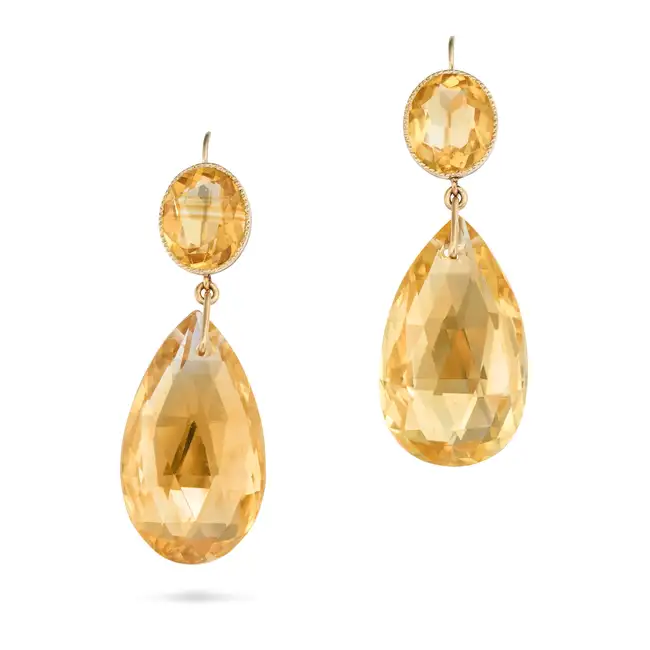 A PAIR OF CITRINE DROP EARRINGS each comprising a large briolette cut citrine drop, suspended from