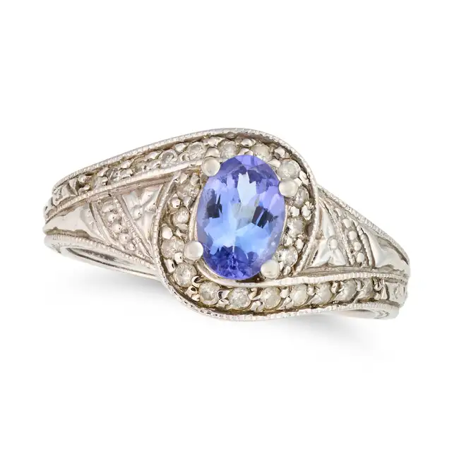 NO RESERVE - A TANZANITE AND DIAMOND RING in 14ct white gold, set with an oval cut tanzanite,