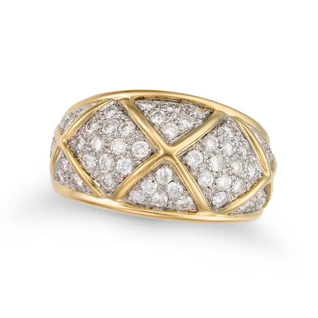 A DIAMOND BOMBE RING the tapering bombe ring pave set with sections of round brilliant cut diamonds,