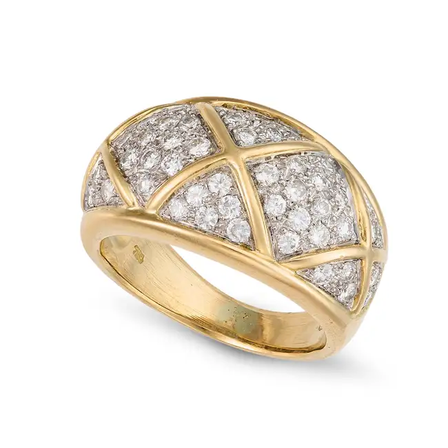 A DIAMOND BOMBE RING the tapering bombe ring pave set with sections of round brilliant cut diamonds,