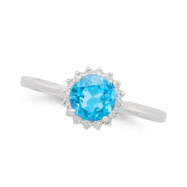 NO RESERVE - A TOPAZ AND DIAMOND DRESS RING in 18ct white gold, set with a round cut blue topaz in a