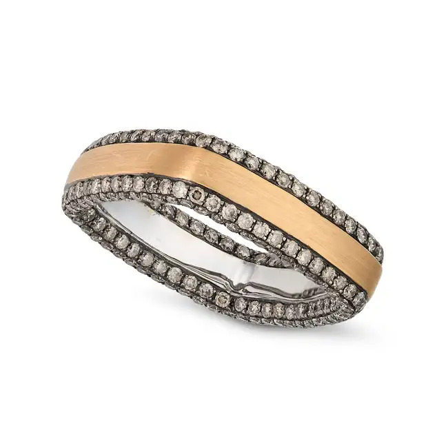 A CHAMPAGNE DIAMOND DRESS RING the band with a brushed finish, accented by pave set round