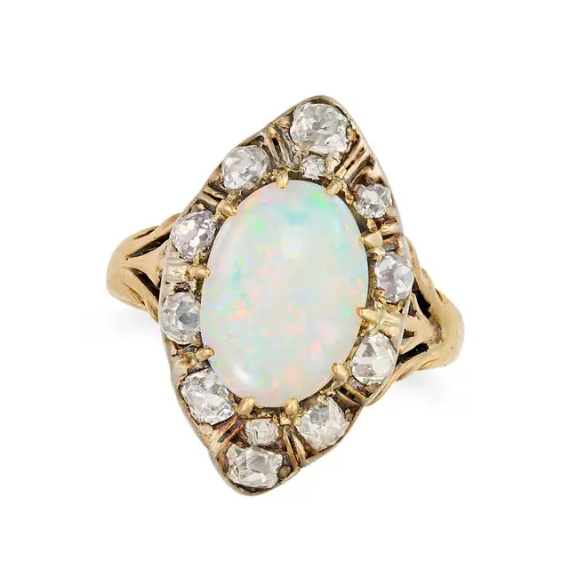 AN ANTIQUE OPAL AND DIAMOND DRESS RING, EARLY 20TH CENTURY set with an oval cabochon opal,
