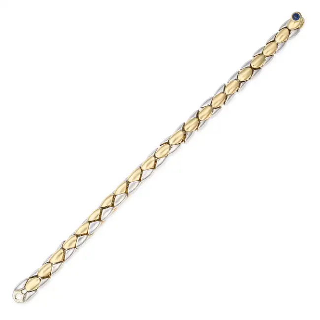 GARRARD, A BICOLOUR GOLD BRACELET in 18ct yellow and white gold, comprising rows of fancy bicolour