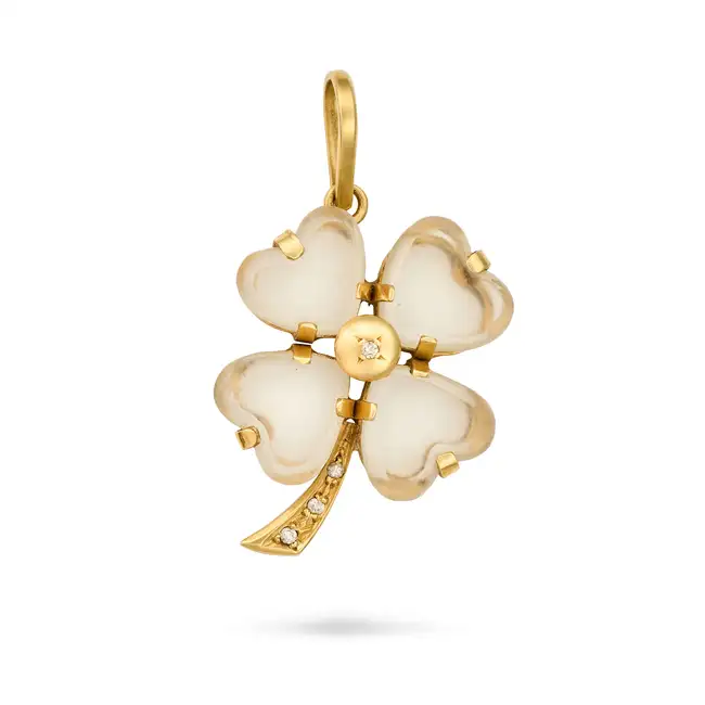 NO RESERVE - A ROCK CRYSTAL AND DIAMOND SHAMROCK PENDANT in yellow gold, designed as a four leaf