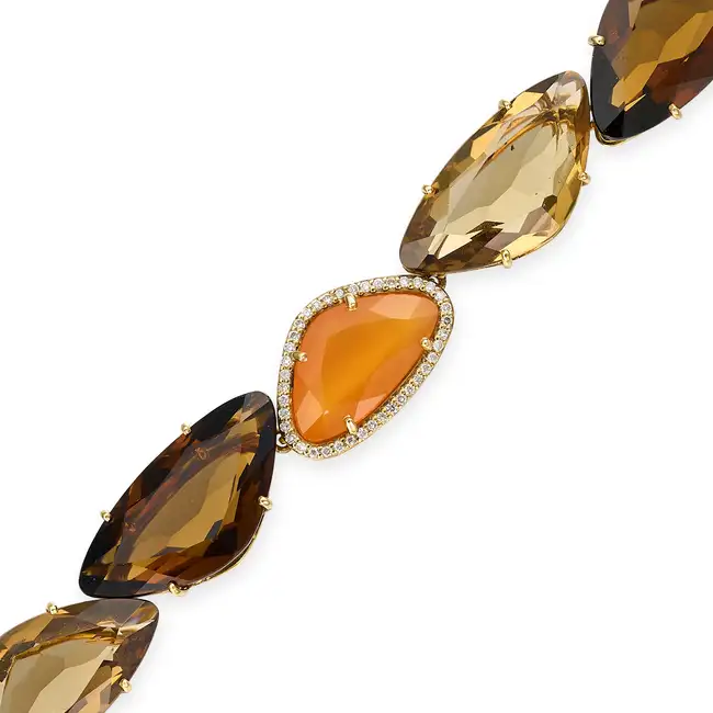 VIANNA, A SMOKY QUARTZ, CITRINE, CARNELIAN AND DIAMOND BRACELET comprising a row of mixed cut