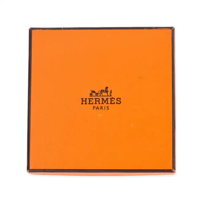 NO RESERVE - HERMES, AN ENAMEL BANGLE the bangle designed with a scrolling blue Hemres Paris ribbon,