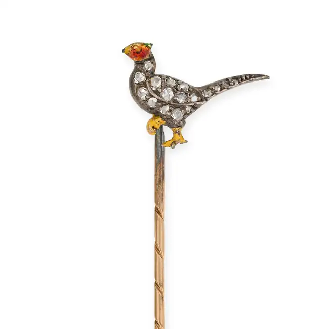 AN ANTIQUE DIAMOND AND ENAMEL PHEASANT STICK / TIE PIN designed as a pheasant set with rose cut