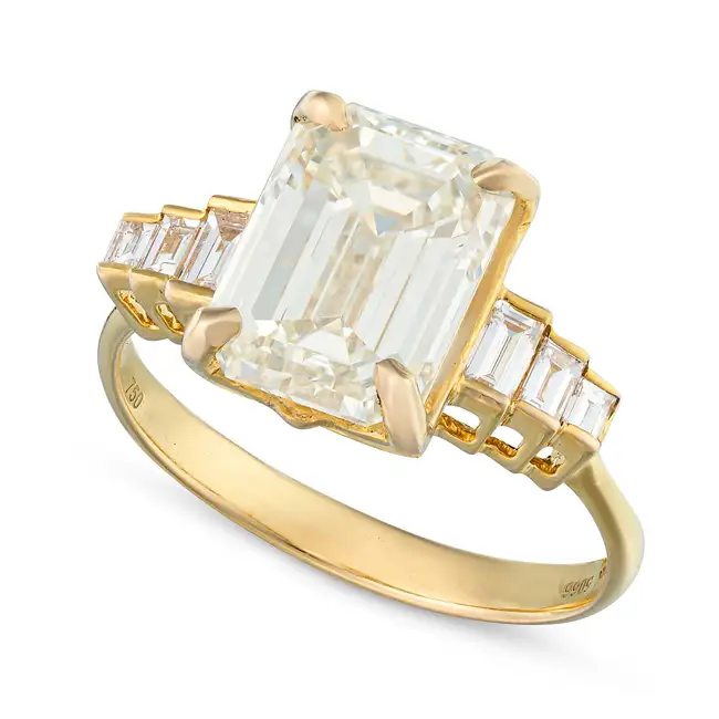 A 4.02 CARAT SOLITAIRE DIAMOND RING set with an emerald cut diamond of 4.02 carats, the stepped