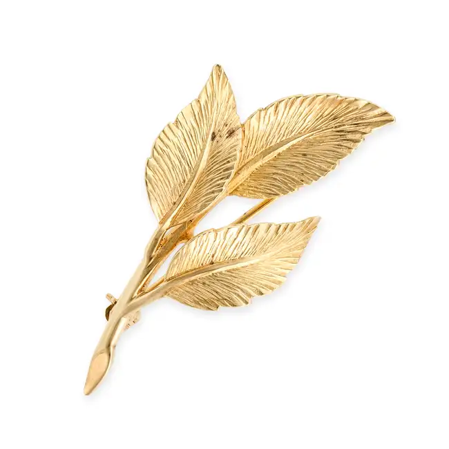 GARRARD, A GOLD LEAF BROOCH in 18ct yellow gold, designed as a sprig of three leaves, signed Garrard