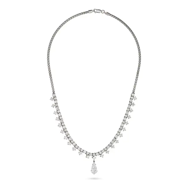 A FINE DIAMOND NECKLACE set with a row of round brilliant cut diamonds, suspending a row of round